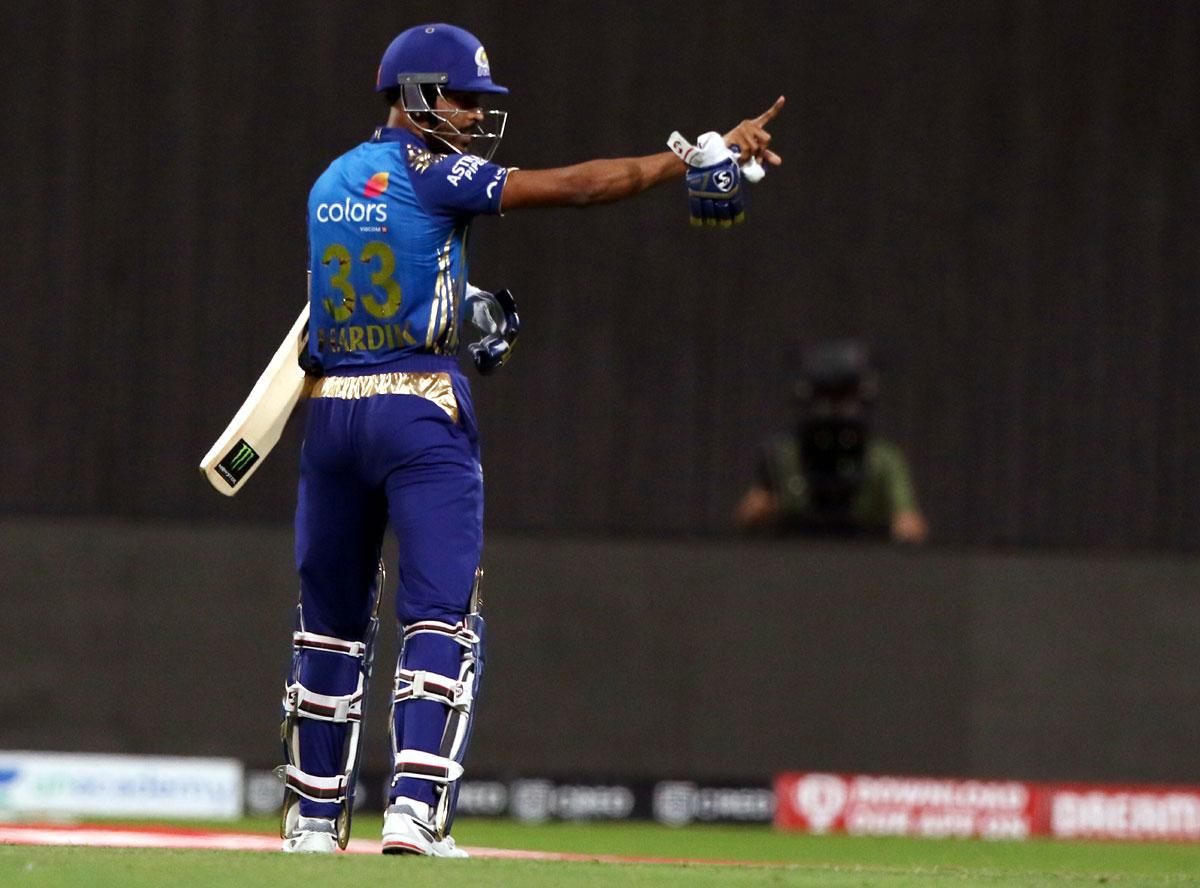 Hardik Pandya exchanges words with a RCB player as he walks back after his dismissal