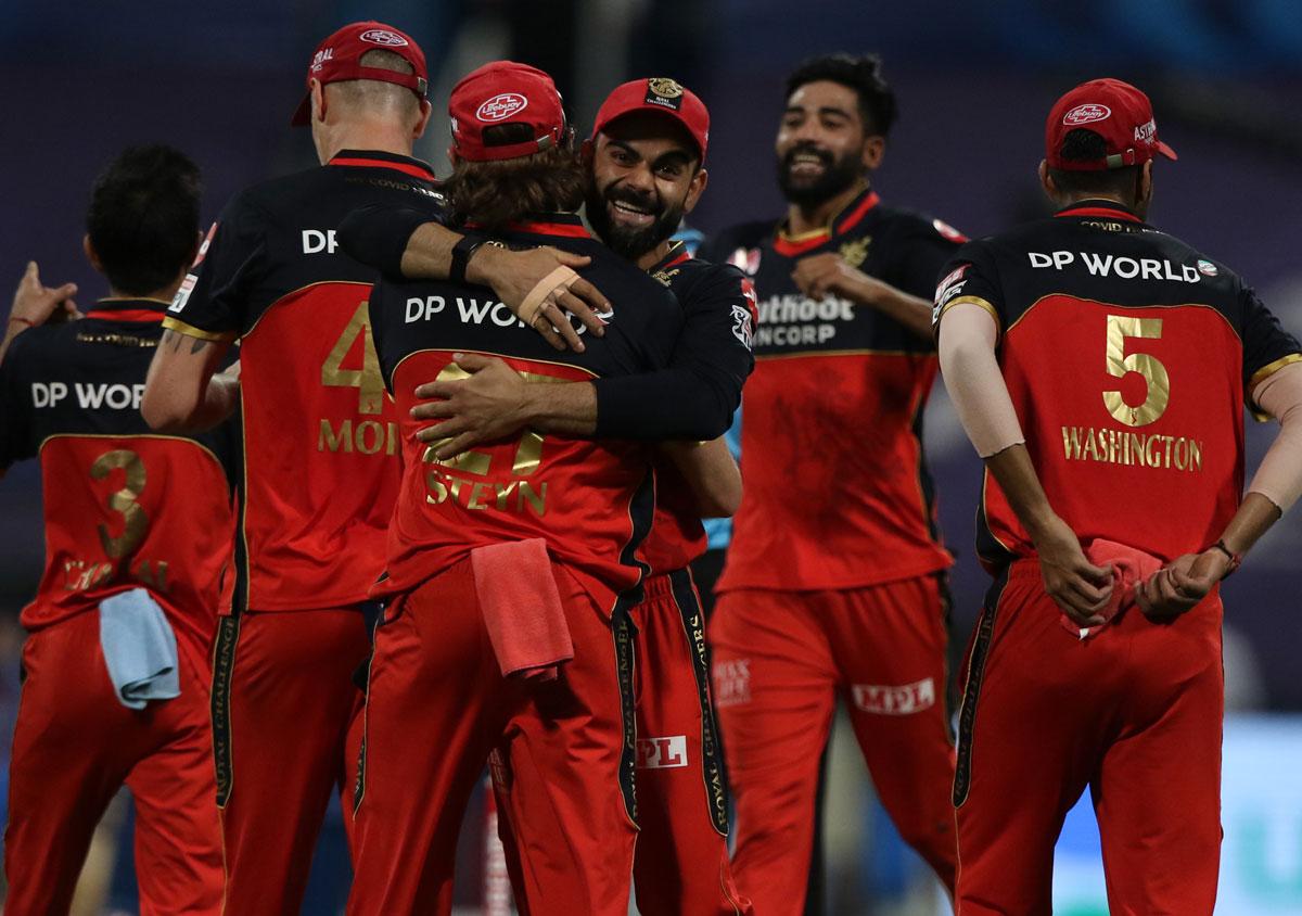 Royal Challengers Bangalore celebrate the wicket of Ishan Kishan