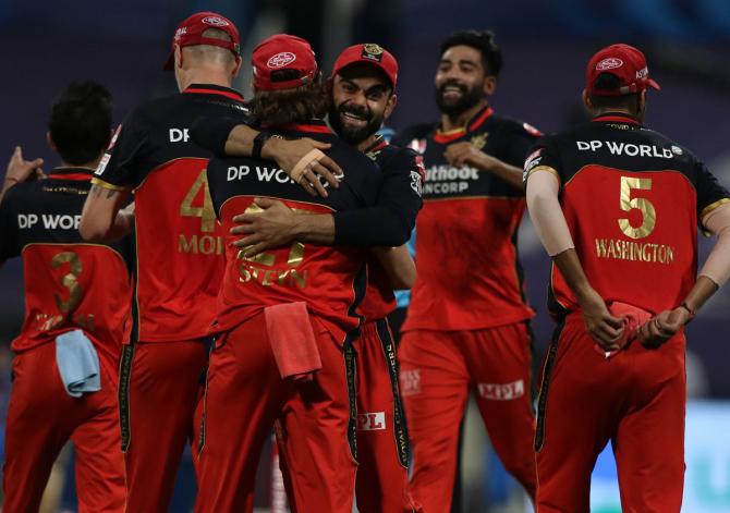 Royal Challengers Bangalore celebrate the wicket of Ishan Kishan