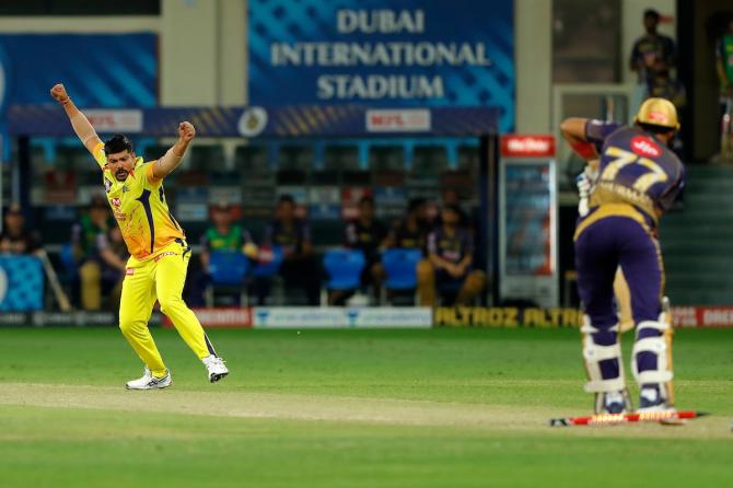 Karn Sharma celebrates after crashing into the stumps of Shubman Gill