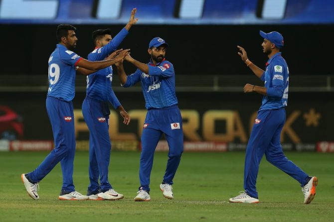 Delhi Capitals players celebrate after Ravichandran Ashwin dismisses  David Warner in the IPL match against SunRisers Hyderabad in Dubai.