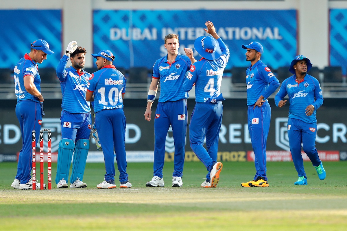 Delhi Capitals players celebrate after Anrich Nortje dismisses Mumbai Indian opener Quinton de Kock in the IPL match in Dubai on Saturday