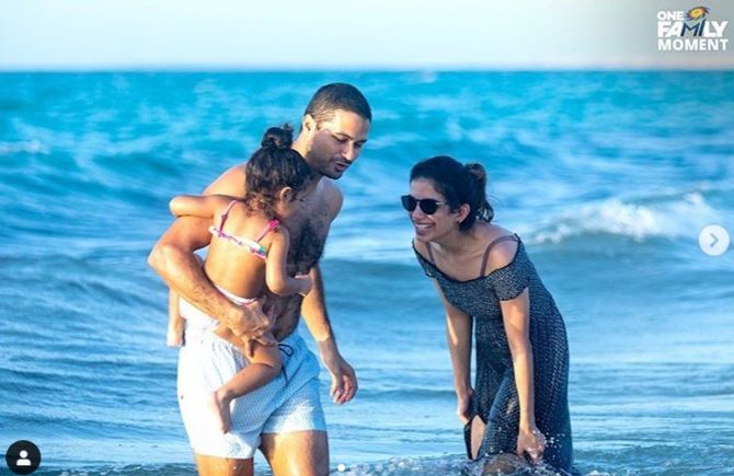 Mumbai Indians' Aditya Tare and his family at the beach in Abu Dhabi on Tuesday