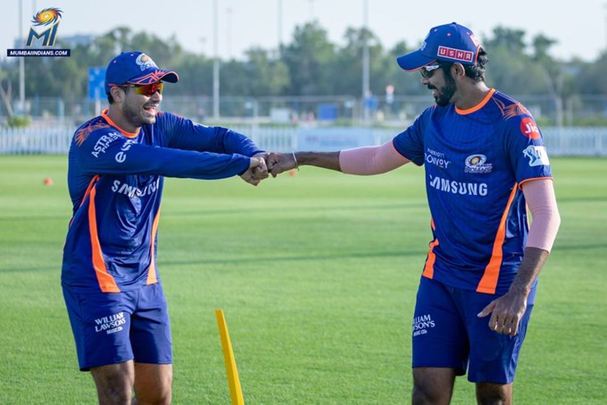 Mumbai Indians' Aaditya Tare and Jasprit Bumrah have some fun during a training session