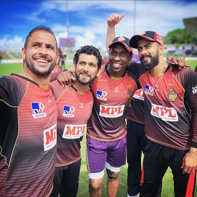 Sikandar Raza (2nd from left) celebrates with TKR teammates after their CPL win on Thursday