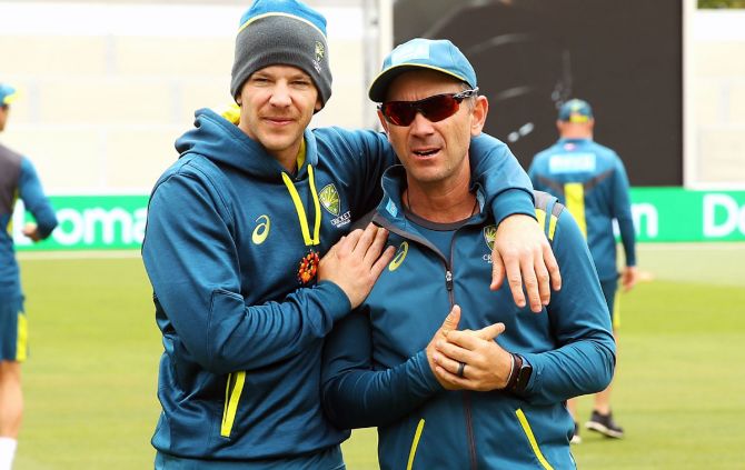 Australia coach Justin Langer with captain Tim Paine. Langer refuted the claims that his relationship with players had soared.
