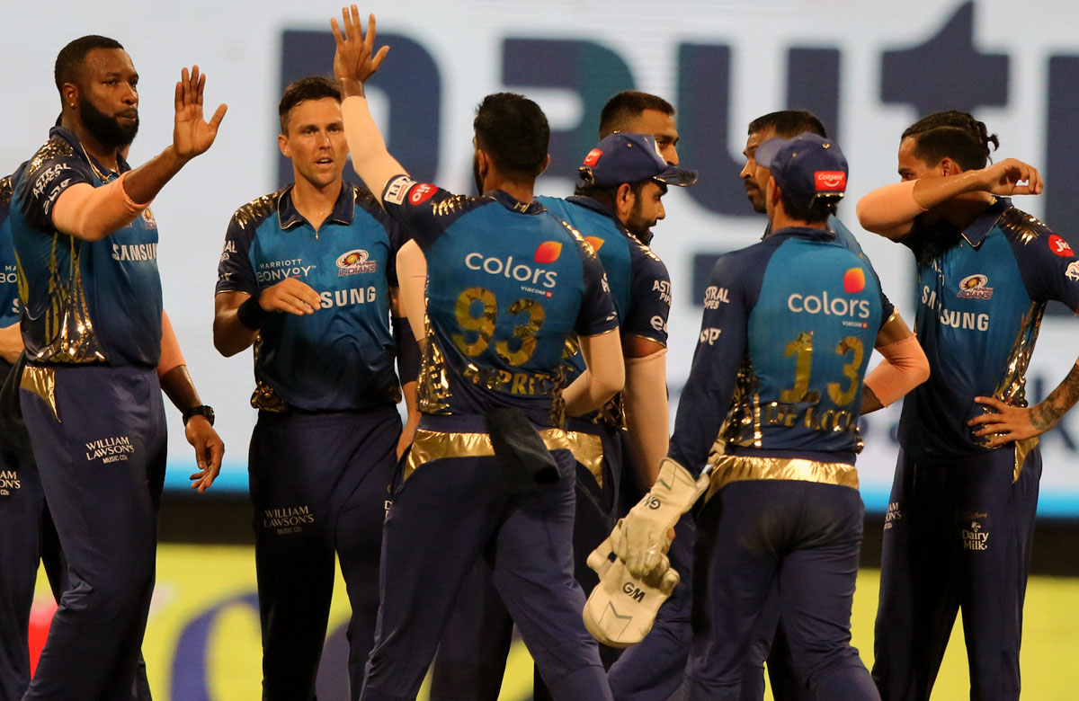 Mumbai's players celebrate the wicket of Shubman Gill