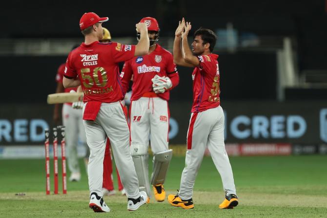 Ravi Bishnoi celebrates the wicket of Aaron Finch.