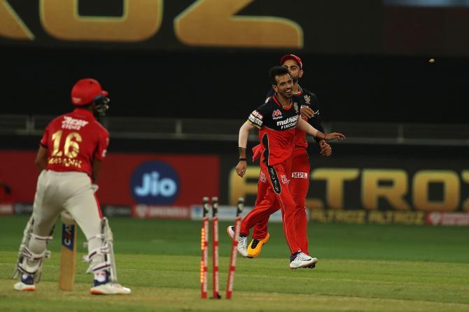 Yuzvendra Chahal is congratulated by his RCB teammates after dismissing Mayank Agarwal