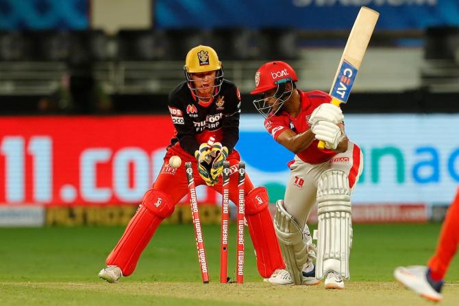 Yuzvendra Chahal breaks through the defence of Mayank Agarwal.