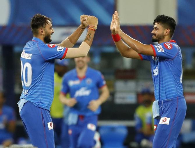 Axar Patel celebrates on claiming the wicket of Shane Watson