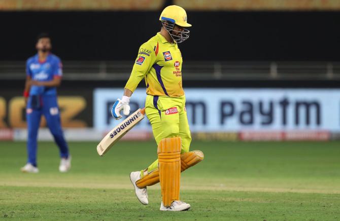 A disappointed Mahendra Singh Dhoni walks back after his dismissal.