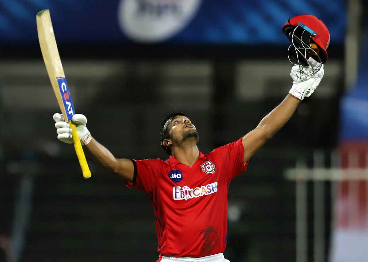 Mayank Agarwal celebrates after completing a hundred