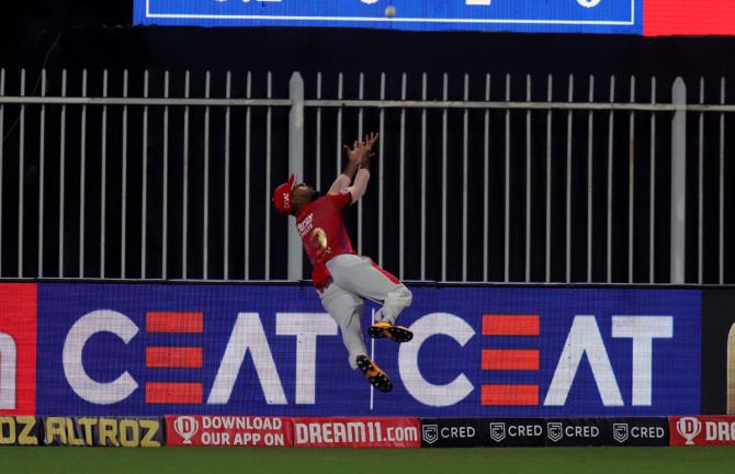 Kings XI Punjab's Nicholas Pooran lunges to catch the ball during the IPL match against the Rajasthan Royals on September 27, 2020