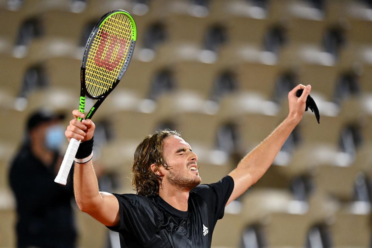 Greece's Stefanos Tsitsipas celebrates after winning match point against Spain's Jaume Munar.