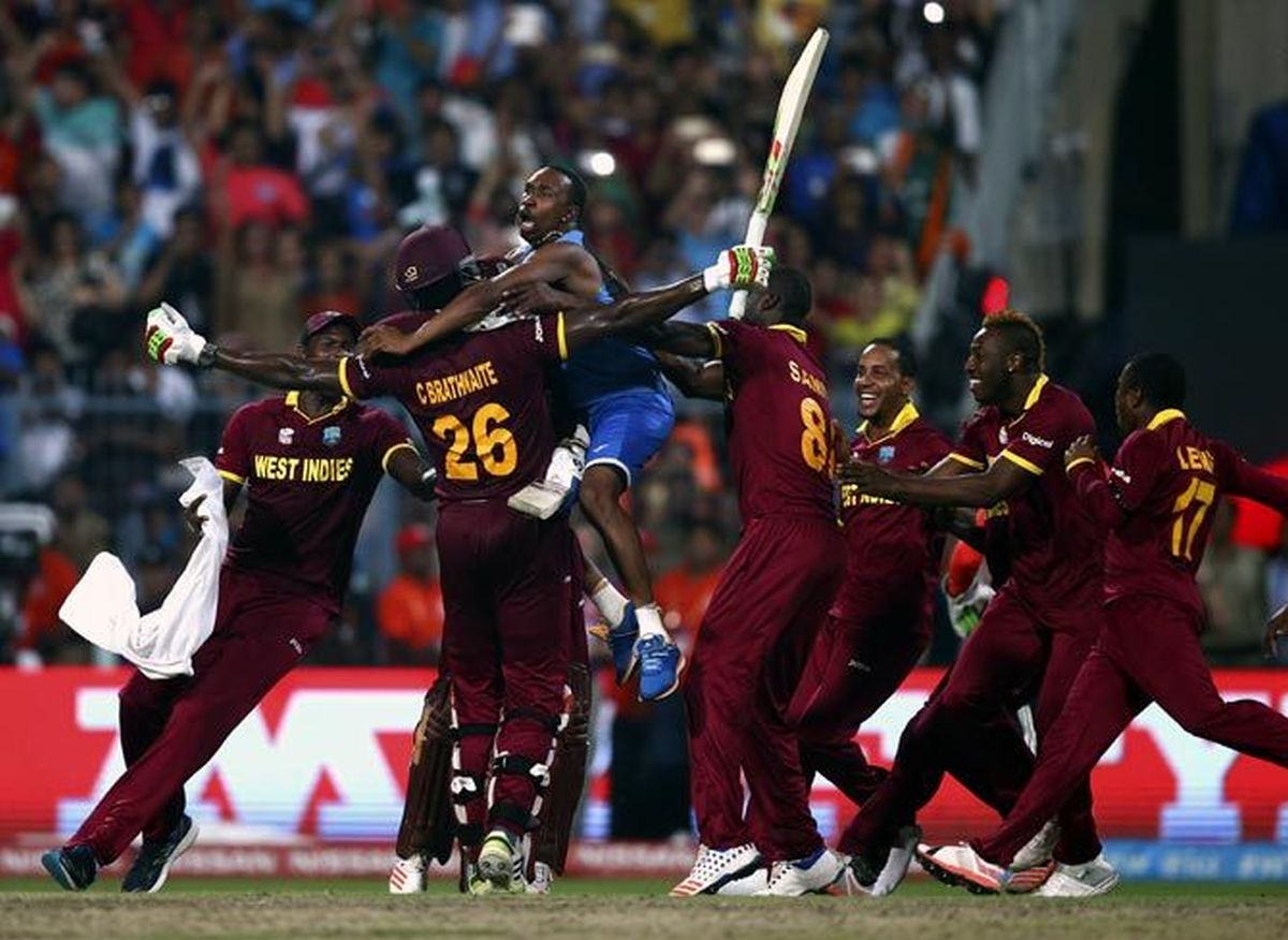 Carlos Brathwaite celebrates with his West Indies team mates after winning the World T20 final against England, in Kolkata on April 3, 2016