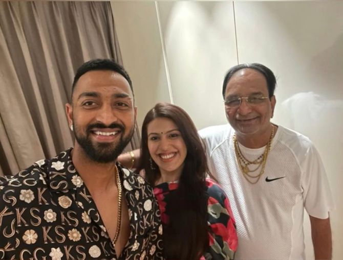 Krunal Pandya with his wife and father