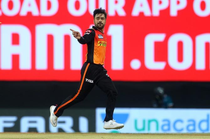 Rashid Khan celebrates after dismissing Shubman Gill.