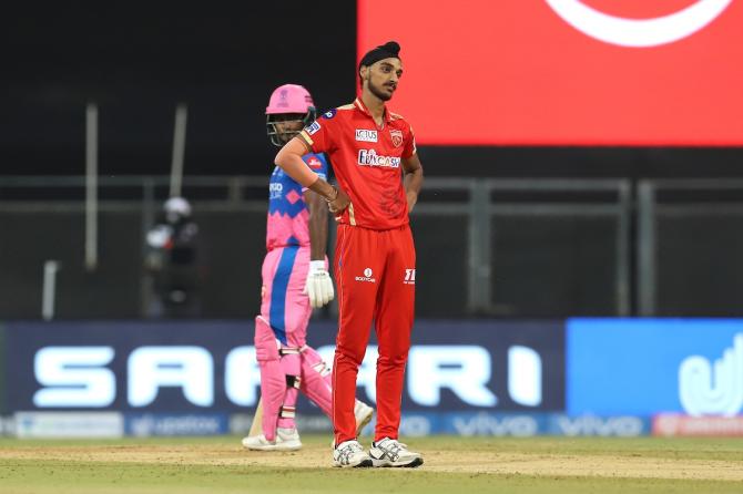 Arshdeep Singh reacts after taking a return catch to dismiss Manan Vohra.