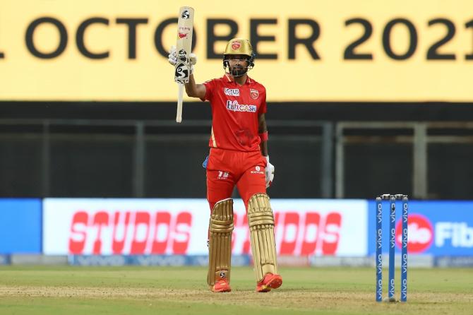 Punjab Kings captain KL Rahul waves to the dressing room after completing 50.