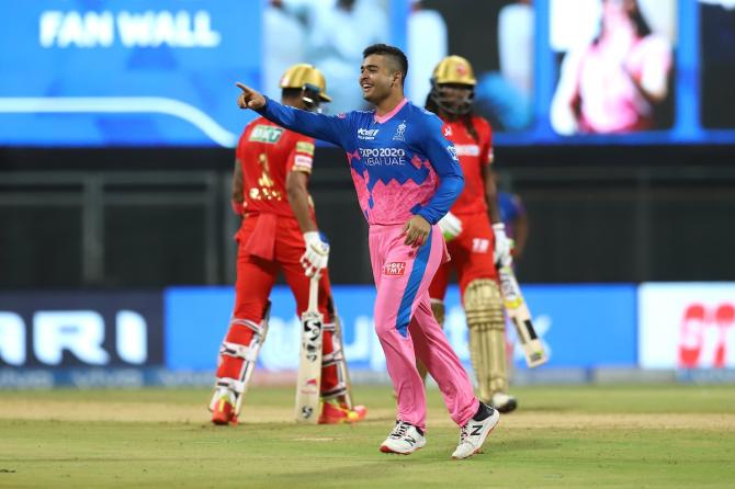 Riyan Parag celebrates the wicket of Chris Gayle