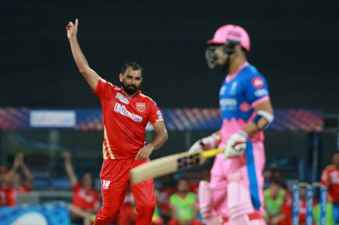 Mohammad Shami celebrates after taking the wicket of Riyan Parag.