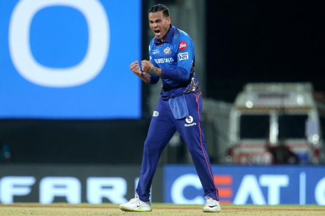 Mumbai Indians spinner Rahul Chahar celebrates the wicket of Kolkata Knight Riders batsman Shubman Gill