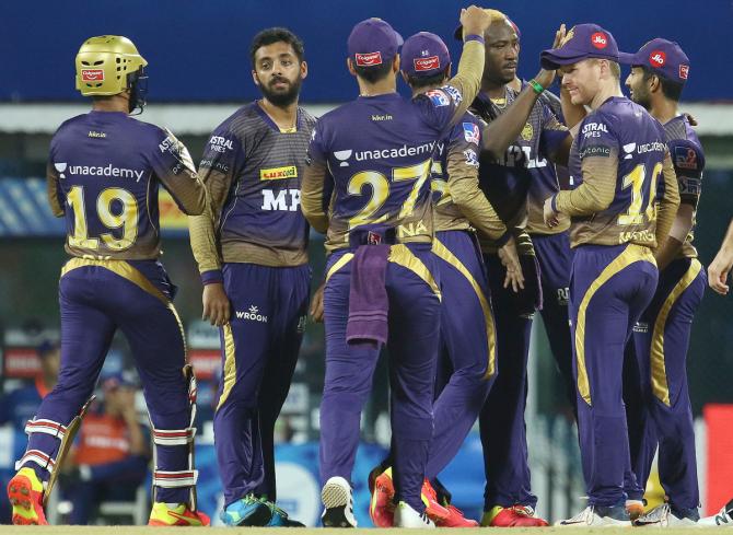 Varun Chakravarthy celebrates with teammates after dismissing Quinton de Kock