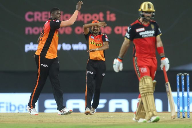 Jason Holder celebrates after dismissing Virat Kohli
