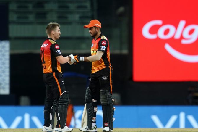 David Warner and Manish Pandey celebrate a boundary