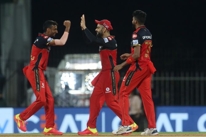 Shahbaz Ahmed and Virat Kohli celebrate after Royal Challengers Bangalore clinch victory over SunRisers Hyderabd in the IPL match, in Chennai on Wednesday