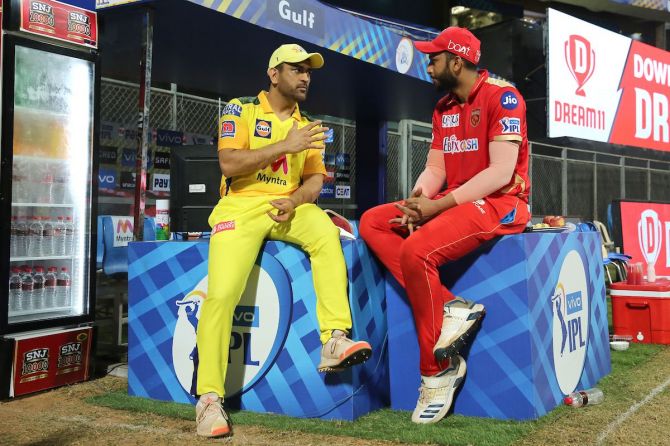 CSK captain Mahendra Singh Dhoni speaks with Punjab Kings' Shahrukh Khan after their IPL match on Friday
