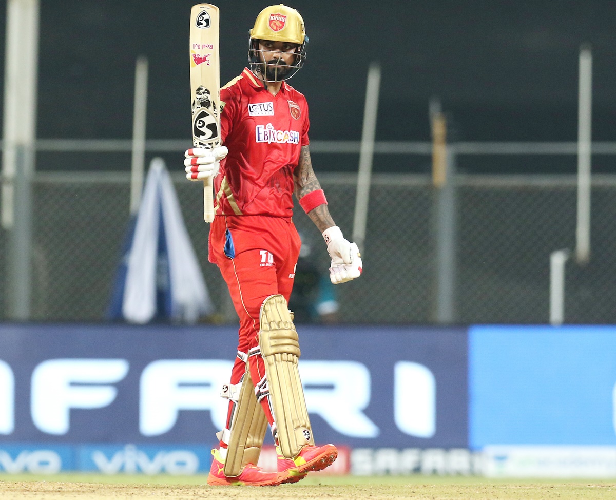 K L Rahul celebrates after completing his 50