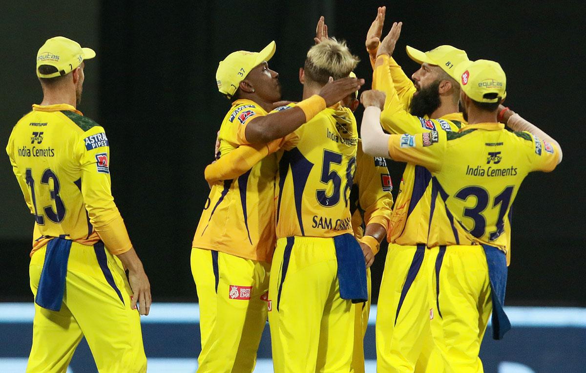 Sam Curran is congratulated by his Chennai Super Kings teammates after dismissing Sanju Samson