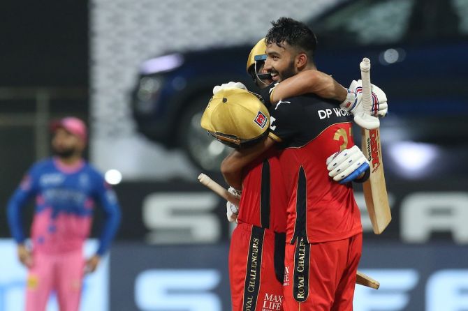 Devdutt Padikkal gets a hug from skipper Virat Kohli after completing his hundred.
