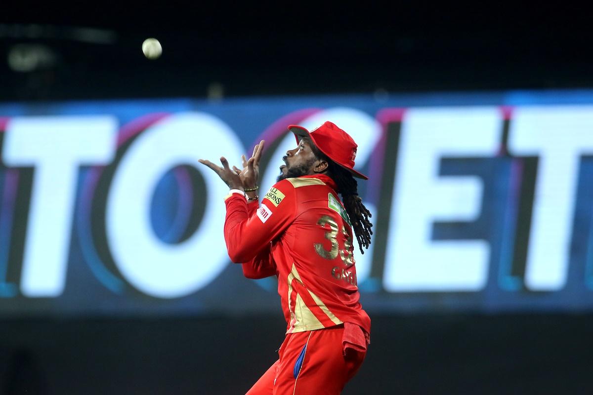 Chris Gayle takes the catch to dismiss Surya Kumar Yadav 