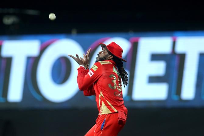 Chris Gayle takes the catch to dismiss Surya Kumar Yadav 