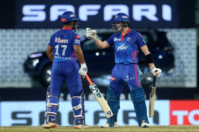 Steve Smith celebrates with Rishabh Pant after hitting six.