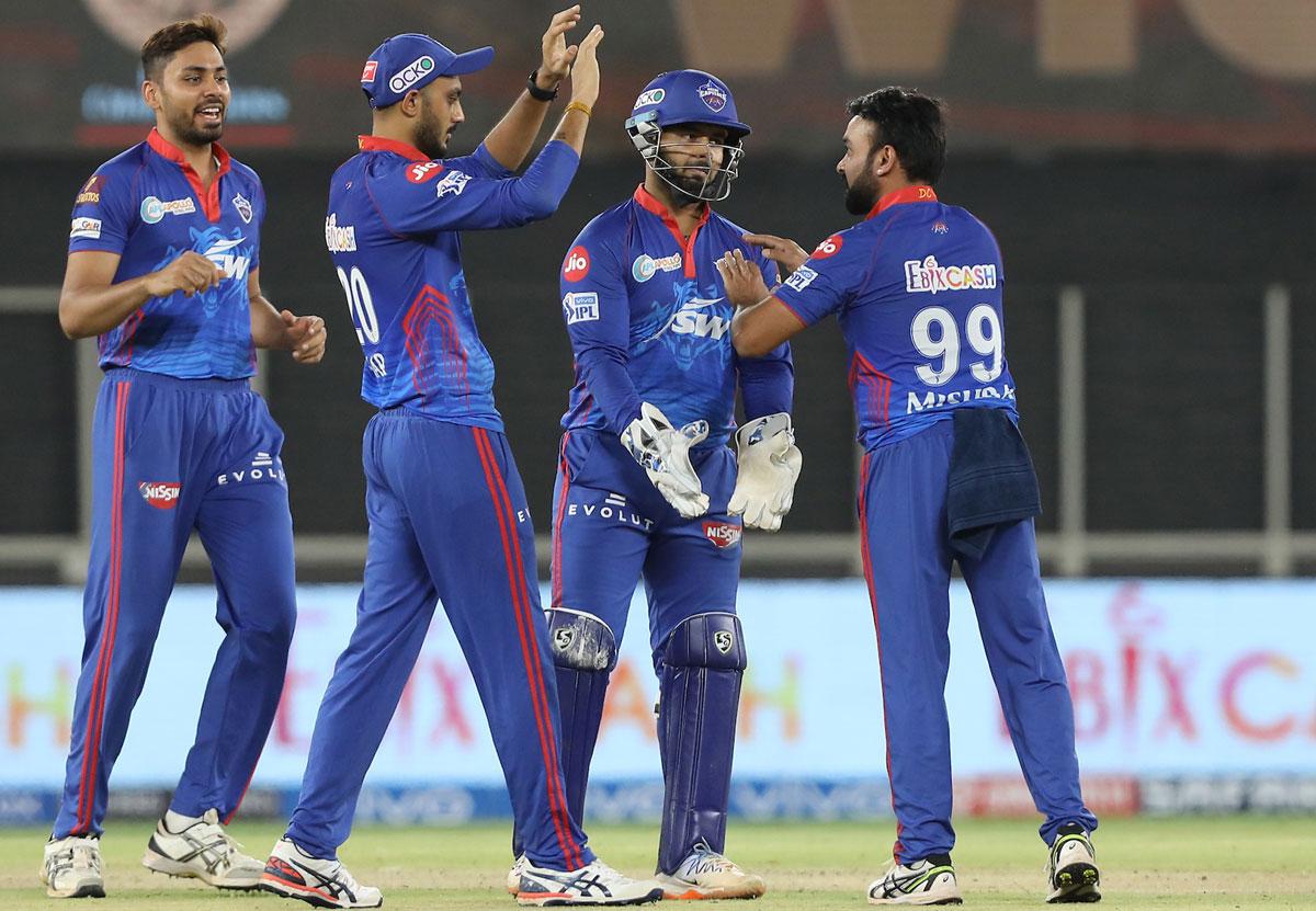 Delhi Capitals players celebrate the wicket of Glenn Maxwell