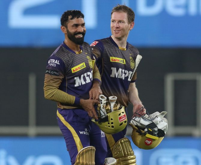 Kolkata Knight Riders skipper Eoin Morgan and Dinesh Karthik are all smiles after victory over Punjab Kings in the IPL match, in Ahmedabad, on Monday. 