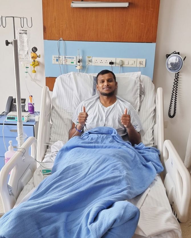 T Natarajan gives a thumbs up after his surgery
