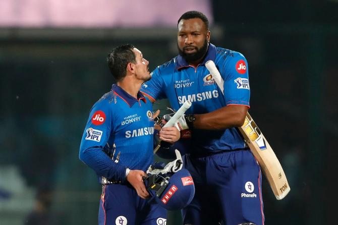 Mumbai Indians batsmen Quinton de Kock and Kieron Pollard celebrate after sealing victory over Rajasthan Royals in the IPL match in Delhi on Thursday