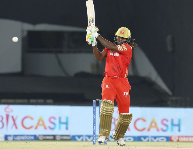 Chris Gayle fires the ball to the boundary