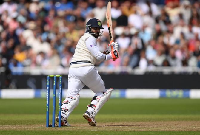 Ravindra Jadeja flicks the ball to the boundary