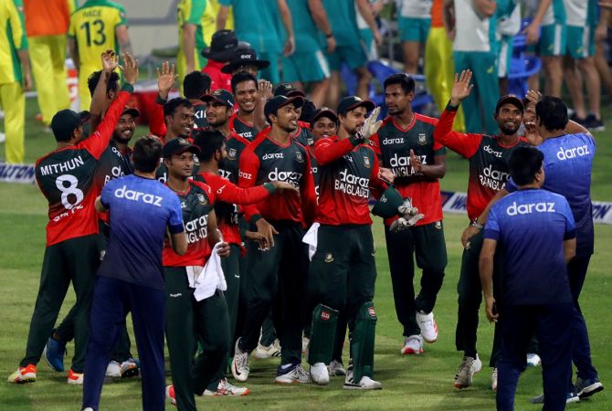 Bangladesh's players celebrate after trouncing Australia in the fifth Twenty 20 International, in Dhaka, on Monday. 