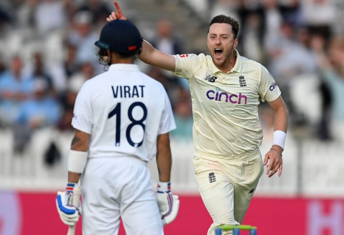 England pacer Ollie Robinson celebrates dismissing India captain Virat Kohli.