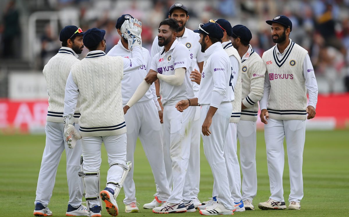 Mohammed Siraj celebrates with teammates after dismissing Dominic Sibley and Haseeb Hameed off successive deliveries.
