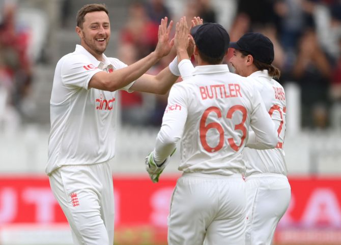 England pacer Ollie Robinson celebrates after taking the wicket of K L Rahul.