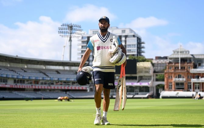 Cheteshwar Pujara, who scored 4, 12 not out and 9 in the three innings he batted on the ongoing tour of England, walks to a nets session at Lord's Cricket Ground.