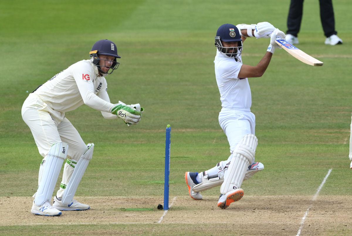 England wicketkeeper Jos Buttler watches as Ajinkya Rahane goes on the backfoot to send the ball to the boundary.